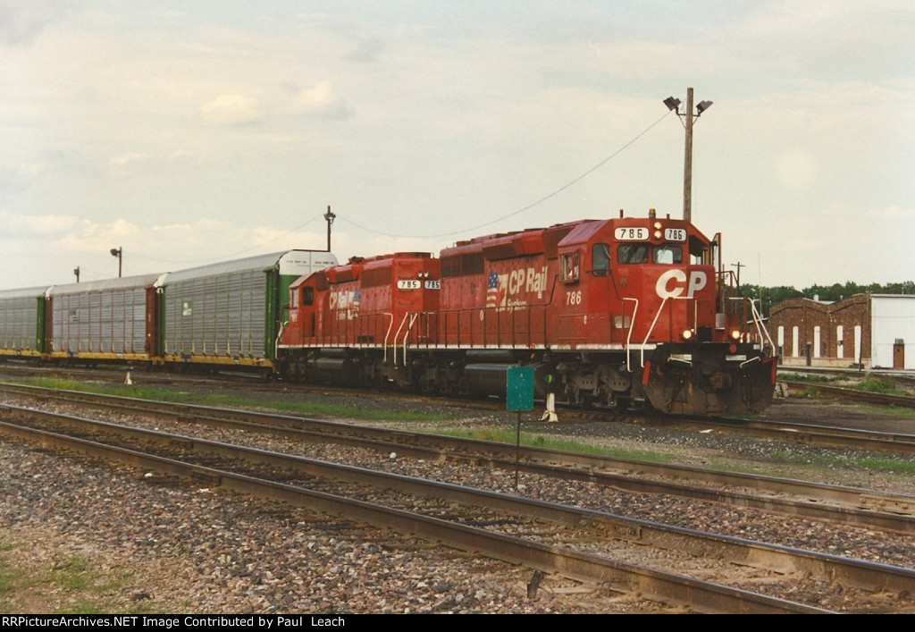 Vehicle train eases west through the yard